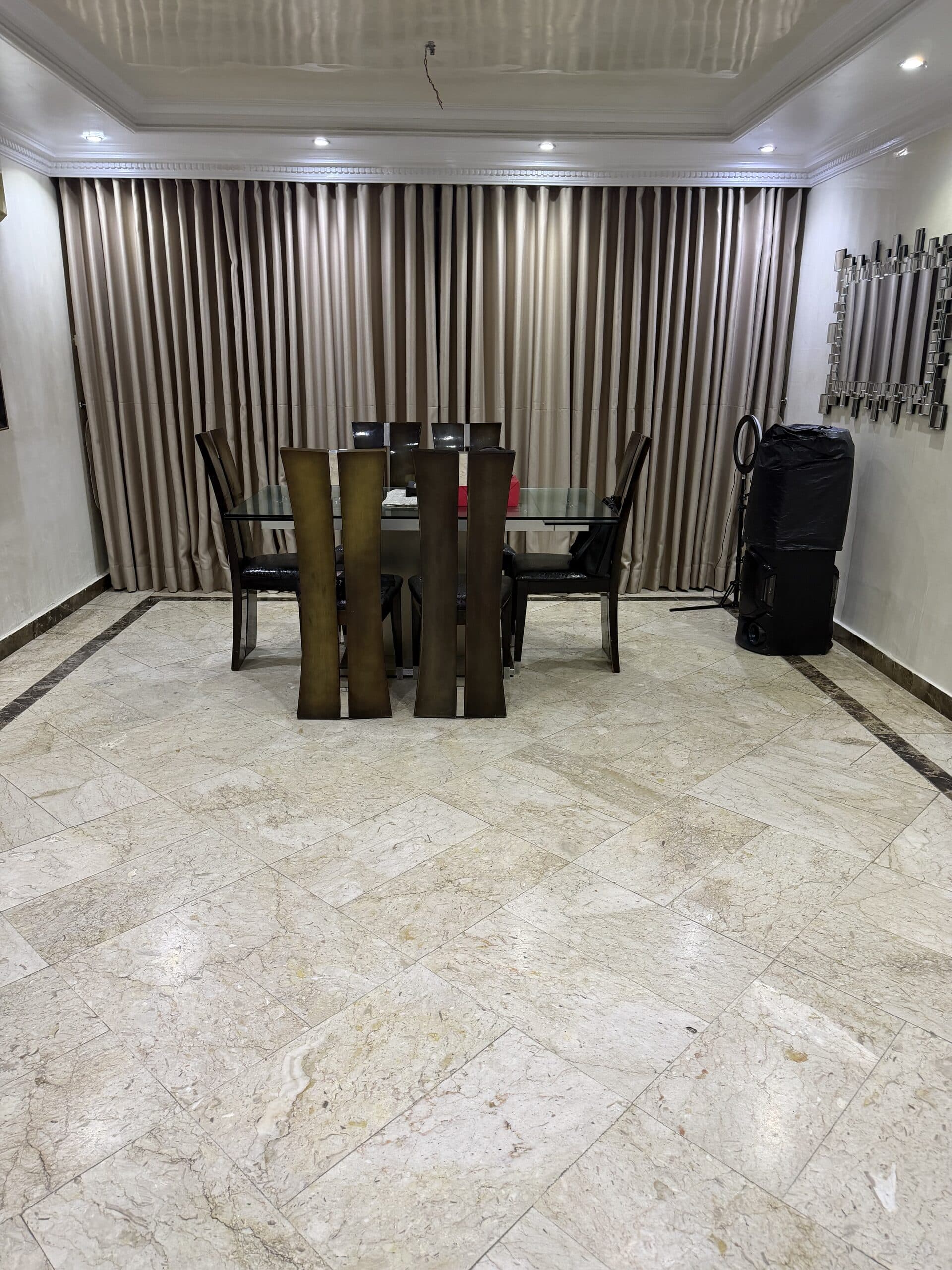 Polished dining room floor and clean curtains after an Etanaya clean